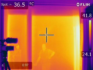 Thermal imaging camera showing temperature transfer outside to inside through energy efficient glass. 